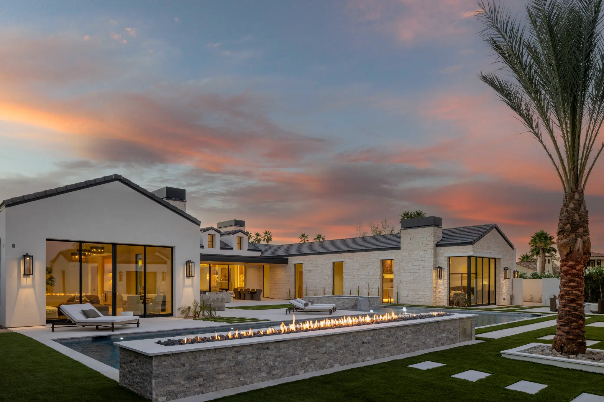 Modern desert exterior architecture with pool and evening lighting