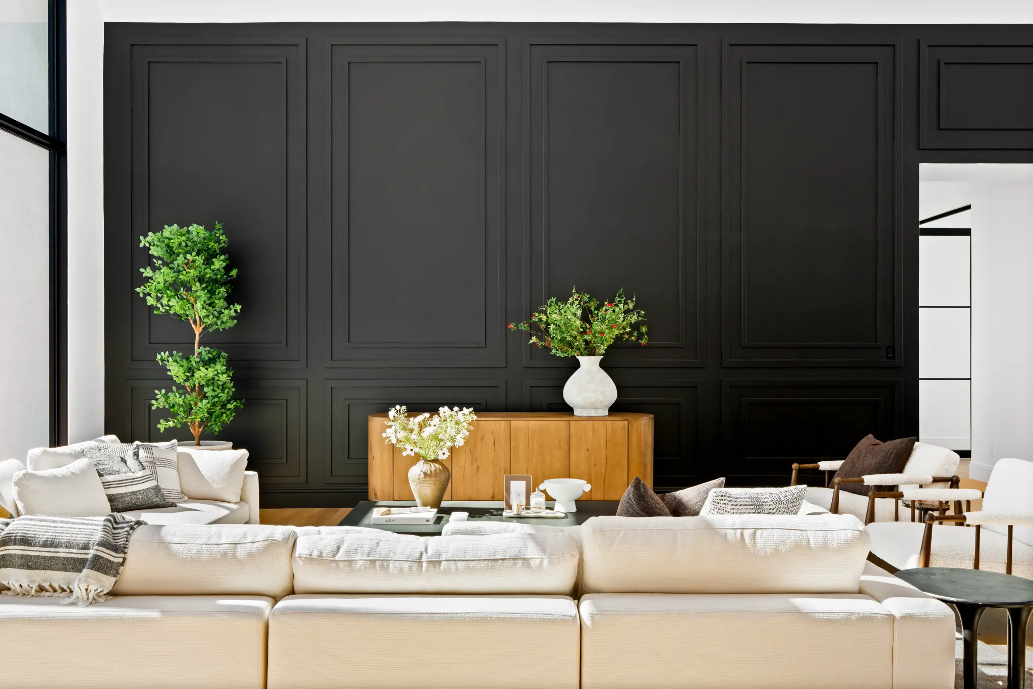Architectural wall paneling detail with custom millwork and premium furnishings